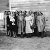Mary Smith (front Center Left) in front of the Old School House  - ID